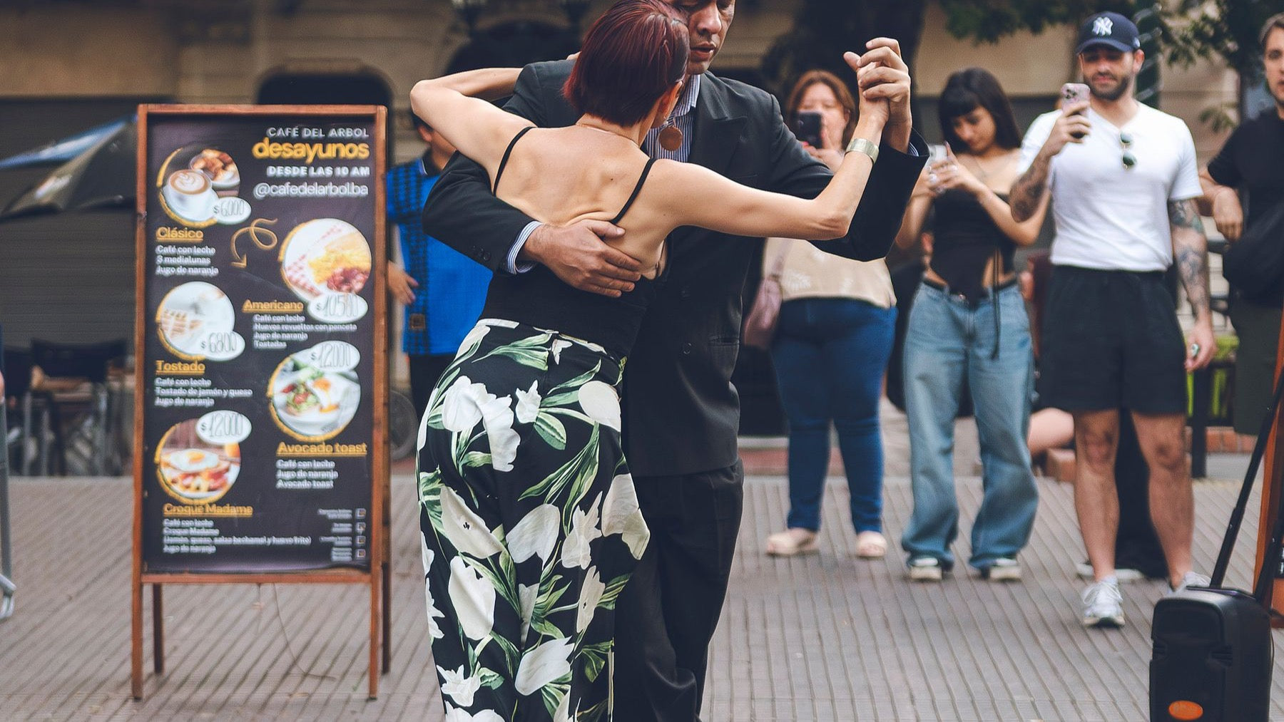 Tango dancers perform for an audience in a public plaza in Buenos Aires.