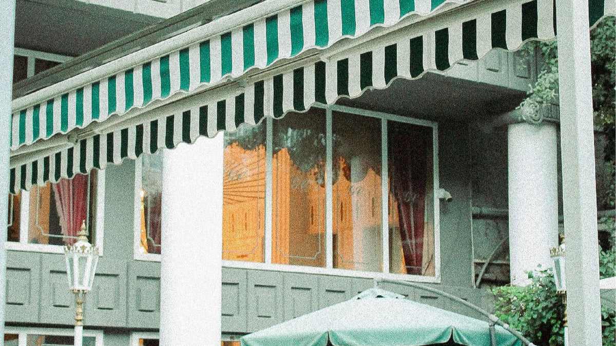 A striped-awning terrace provides an intimate setting for relaxed neighbourhood dining.