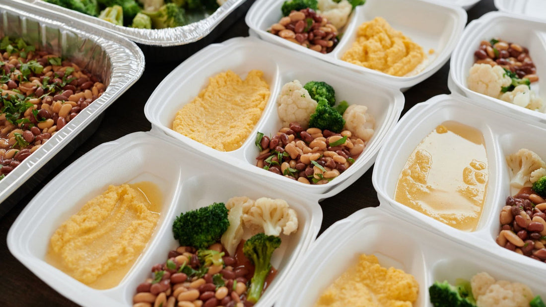 Prepared meals with beans, vegetables and mash are portioned into containers for convenient freezer storage.