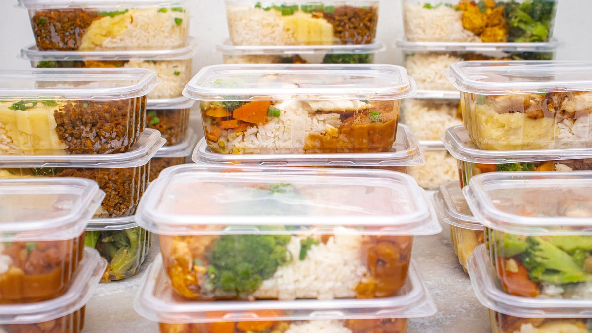 A varied set of portioned meals with rice, vegetables and protein is organised for the week ahead.