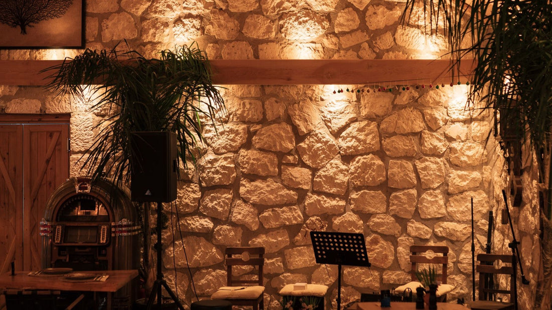A warmly lit restaurant with stone walls and intimate tables offers an atmospheric dinner alternative.