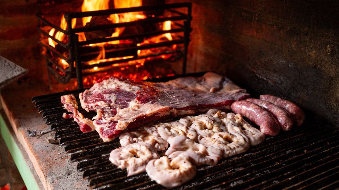 Beef, sausages and achuras cook over the flames of a traditional South American grill.