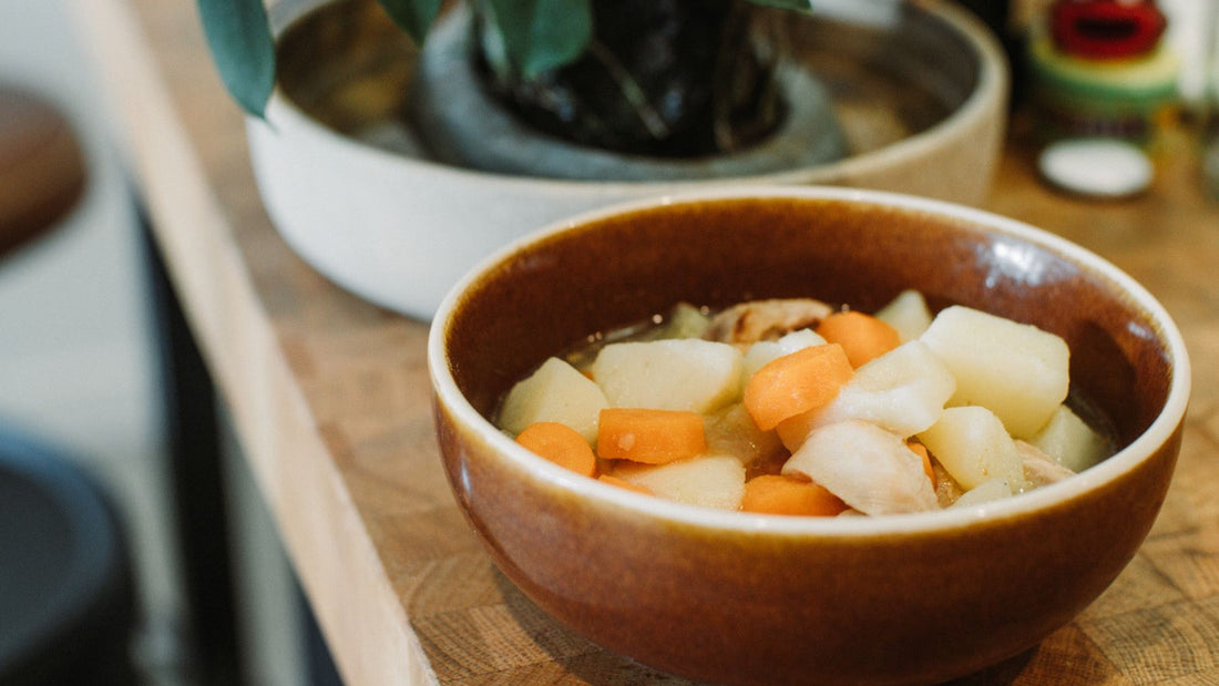A rustic bowl of hearty potato, carrot and chicken stew brings warmth to a Sydney winter meal.