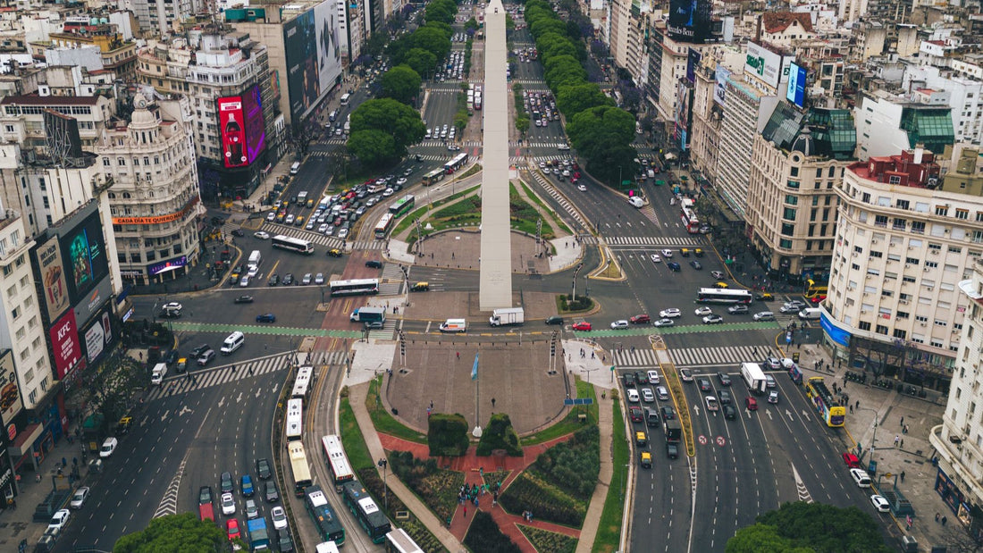 An aerial view of central Buenos Aires surrounds the Obelisk and Avenida 9 de Julio.