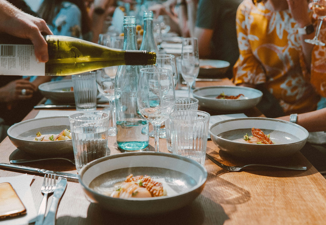 Friends sharing a casual lunch together at a table in Australia.