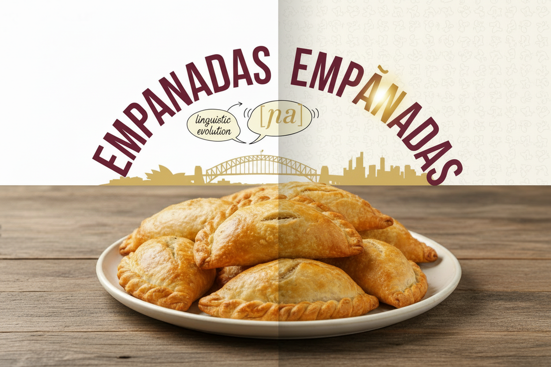 Wide blog header image showing golden baked empanadas with a signpost “empanadas” and “empañadas,” illustrating an article about why Australians pronounce empanadas differently and the Sydney food culture behind it.